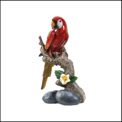 Red macaw on branch